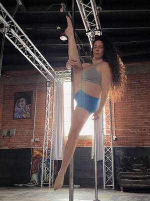 A post by @ruby_licous on TikTok caption: Holding your body weight up is hard. Now add a split, and no hands. ##pole##poledance##fypage##viral