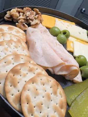 A post by @erikaeclass on TikTok caption: Hey bestie ❤️ Sometimes you just need a snack to help you bounce back.  Crackers  Cheese  Olives Pickles Walnuts  Sliced Turkey or Chicken Breast #fy #snack #charcuterie 