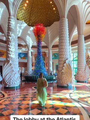 A post by @luxuryworldtravellers on TikTok caption: Even walking through the lobby @Atlantis Dubai can be a reel!  #dubai #luxurytravel #luxuryworldtraveler #luxuryresort