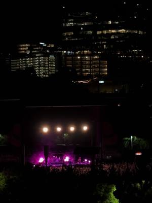 A post by @ericollage on TikTok caption: crowd singing at the chappell roan raleigh concert from the parking garage across the st. #chappellroan #raleigh 