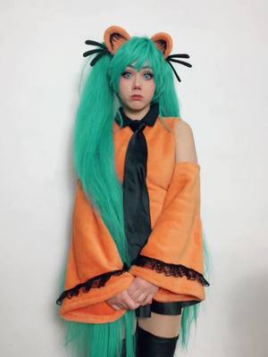 A post by @toastertopia on TikTok caption: i ate it :3 #miku #hatsunemiku #garfield #mikucosplay #garfieldcosplay #garfieldmiku #toastertopia 