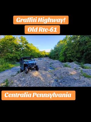 A post by @turboterry77 on TikTok caption: Graffiti highway in Centralia Pennsylvania. Used to be known as old route 61. It's a highway in a abandoned town that the underground is on fire due to a mine fire. People came from all over to tag their name or put memories on that highway, just for Pennsylvania to fill it with random dirt mounds. What a waste of money. Meanwhile Pennsylvania has potholes the size of public swimming pools. #centralia #pennsylvania #graffiti #graffitihighway #abandonedtown #abandonedhighway #abandontown #atv #sidebyside #offroad #offroading #sxs #teryx800 