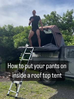 A post by @braxton.klavins on TikTok caption: How do you put your pants on?  RTT : RoofSpace  #overlanding #camping #rooftoptent