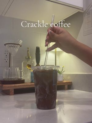 A post by @izzzbeth on TikTok caption: Trying the viral crackle coffee 🧋#cracking #coffee #crackingcoffee #icedcoffee #fyp #coffeetok #satisfyingvideo 