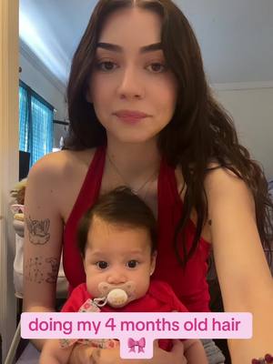 A post by @notmyughh on TikTok caption: her hair is getting longer and idk how to style it 😭 help                                            #firsttimemom #babiesoftiktok #4monthsold #hairstyle 