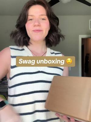 A post by @mdeandesign on TikTok caption: Even as an employee i freak out when i get swag because our brand team is so damn talented i love everythinggg and can never pass up a notebook. 🥹📒  #unboxing #uxdesign #productdesign #figma #figmadesign #uxdesigner #vlogs #aesthetickeyboard @figma 