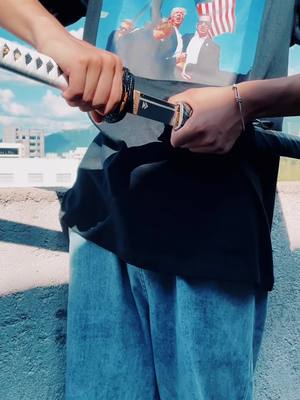 A post by @longquansword on TikTok caption: How's my new T-shirt? #katana #sword #blade #ghostoftsushima #fypage 