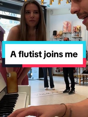 A post by @aurelien.froissart on TikTok caption: This man asked for "Waltzing in the rain" but nobody expected a FLUTIST to join me! Watch his reaction in the end 🥹 #flute #piano #publicpiano #SkyEnfantsdelaLumiere #skychildrenofthelight