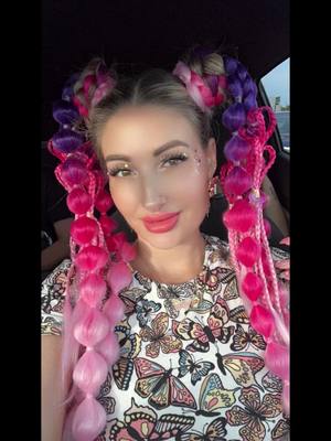 A post by @chers_scent_spot on TikTok caption: My cool hair for the week in Orlando!! I had so much fun with these pre made braids they were easy to install and so colorful just like my personality!! I couldn’t wear them every day because they were a little heavy, so i had to just do some buns a couple days. Much props to you ladies who rock braids daily my head hurts haha!! These were great and i will definitely do it again! My pink heart ones were my favorites!!! #braids #coloredbraids #ravehair #partyhair #sfrhair #orlando #sfr2024 #fyp #bubblebraids #hairextensions #funhairstyles 