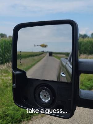 A post by @shankbaitco on TikTok caption: look what landed on the road.. what was it doing.  #farm #farming #Illinois #crops #helicopter #agriculture #Summer #midwest 