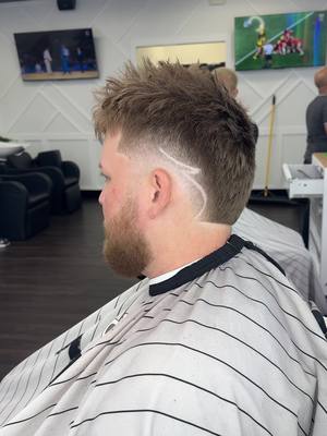 A post by @barberbailey on TikTok caption: Burst fade with design 🔥 #barber#haircut#burstfade