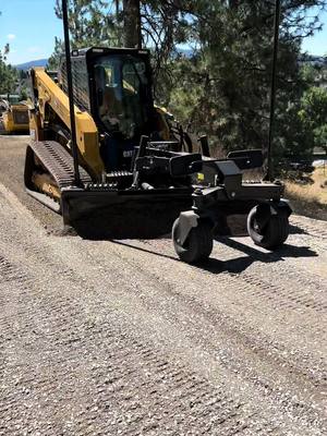 A post by @teamrockymountain on TikTok caption: Got that new #cat #265 #cat265 skidsteer with the #gb124 #excavation #paving #road #gravel #dirtlife #construction #inw #rockymountains 