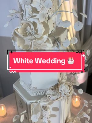 A post by @jeffreyselden on TikTok caption: Dreaming of your perfect wedding cake? 🤍✨ This elegant white wedding cake from #ninecakes is the epitome of timeless beauty and sophistication. With its delicate floral accents and intricate details, it’s sure to be a showstopper!  Imagine this masterpiece at your wedding! 🌸👰💍 #WhiteWeddingCake #WeddingInspiration #CakeGoals #BridalDreams #ElegantWeddings #Cakery #ctcatering #nycatering #marciaseldencatering @Amy Katz Events @Marcia Selden Catering #tantawanbloom 