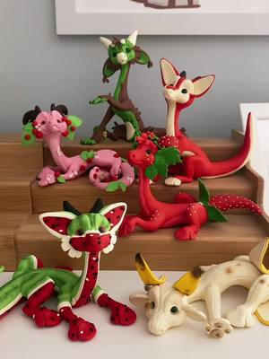 A post by @sanctuaryofdreams on TikTok caption: Cute little fruit dragons have arrived at the sanctuary!!! Adopt them at the link in my bio ^^ #polymerclaydragons #dragonartist #handmadedragon #polymerclayartist #dragon 