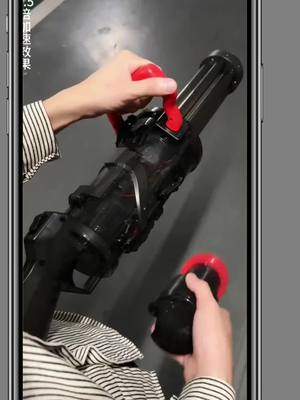 A post by @alongalong40 on TikTok caption: No one should be able to refuse the powerful Gatling water gun, is it so cool? Electric water gun battle. 3 #fy #Trending #fyp #foryou