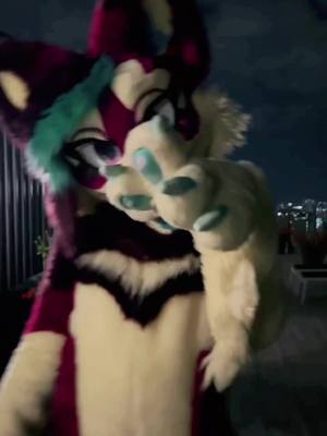 A post by @phoenixawoo on TikTok caption: Hello sorry its been so long! Did you miss this big purple dog? #fursuit #furry #phoenixnest 