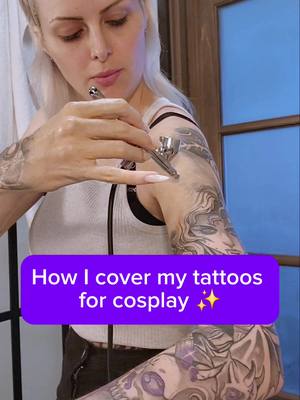 A post by @kinpatsucosplay on TikTok caption: How I cover my tattoos for cosplay  I use an airbrush with enduraskin airbrush makeup and Eva pro setting spray. ✨ ‼️Now please know -  you never have to feel obligated to cover your tattoos in cosplay I often do NOT cover them because I'm lazy and I will just do it for big photoshoots as a personal preference, this is not expected whatsoever and you should never be ashamed of your tattoos in cosplay.‼️ But for those who are interested this is how I do it now. I've had tattoos ever since I started cosplay and used cream based makeup for many years and HATED IT. it was super messy and get everywhere and took hours do apply.  Airbrush makeup lets me cover my tattoos in half the time.  This makeup is also waterproof so I have literally gone swimming with it at pool conventions.  It also doesn't crack or rub off as easily as other makeup. On my hands and fingers this is very important! I will actually struggle to get the makeup off at the end of the day! 😅  Of course with consistent rubbing and sweating in some spots if will flake off a bit eventually but for the  most part its way more durable!!!  It also applies really smoothly so it can blend with your skin well!  So If  you ever want to cover your tattoos or do it on a regular basis I hope this helps! 😁 #cosplaytips #tattoos #tattoomakeup #tattoocover #makeup #makeuptutorial #cosplaymakeup  #endura #cosplay 