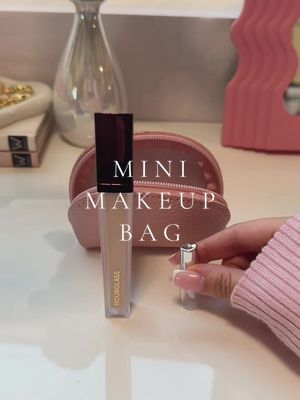 A post by @jessgaciaa on TikTok caption: diy mini makeup bag 🥹💖 the perfect touch up kit to keep in your purse to touch up on your makeup throughout the day!  products:  @elfcosmetics- grip primer  @Summer Fridays- milk sunscreen & lip balm @Saie- bronzing drops @Hourglass Cosmetics- concealer  @Rare Beauty- bronzer stick & liquid blush  @Huda Beauty- baking powder  @Anastasia Beverly Hills- eyebrow wax @Charlotte Tilbury- setting spray & lip liner @Lancôme- lengthening and volumizing mascara #minimakeupbag #miniature #makeup #sephora #makeupbag #skincare #makeupessentials #essentials #beauty #BeautyTok #diymakeup #whatsinmybag #minibag #whatsinmypurse #whatsinmymakeupbag #packwithme #packmymakeupbagwithme #travelsize #restock #asmr #asmrsounds #aesthetic #satisfying #fyp #foryoupage #viral #cleangirl #musthaves #amazon #amazonfinds 