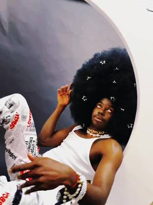 A post by @paulithepsm on TikTok caption: Who are you taking for a photoshoot on the moon?? Tag your sunshine below!!🌛💖🌞 #youaremysunshine #afro #afrofuturism #moon