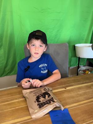 A post by @not__a__fed__ on TikTok caption: our 8 year old really wanted to try an MRE. Here is his review !   #survival #Outdoors #camping #homeschooling #MRE #tips @MissyNicole✨ 