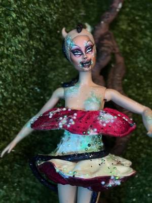 A post by @pythia.queen on TikTok caption: Custom Barbie Doll repaint of my Garden of Eden look from RuPaul’s Drag Race Global All Stars! Repaint and body/snake by me, Apple Doll Costume by @/sorrygottasew on insta! #customdoll #custombarbie #ooak #ooakdoll #dollrepaint 