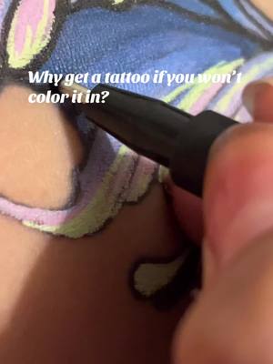 A post by @nux_art on TikTok caption: ✨ Don’t be sad, color your tattoos ✨ // didnt think to record untkl the end lol #tattoo #tattooedgirl #coloringbookforadults #coloring 