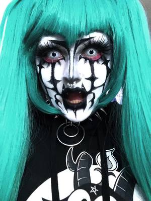 A post by @inky.teeth on TikTok caption: miku draft :3 #mikucosplay #mikuhatsune #mikuhatsunecosplay #gothmiku #gothmikuhatsune 