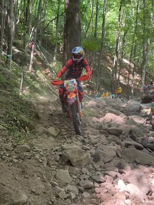 A post by @iridehardenduro on TikTok caption: good fightin' 🔥 it was a close race until the end between @m_letti304 and @trystanhart84 at @tkoenduro  #iridehardenduro #hardenduro #Motorsport #racing 