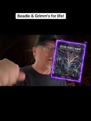 A post by @matthew_lillard_ on TikTok caption: Faster Purple Worm! Kill! Kill! Is one of the great accomplishments of my/our lives! We’ve built a sourcebook, so you can play at home! How fun are we? Please consider supporting our new #kickstarter! I will love even more than I already do! Link in Bio #DnD #rpg @Beadle & Grimm's 