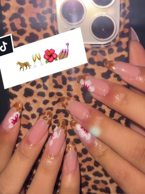 A post by @love.reli on TikTok caption: These nails were so cute to make 🐆🌺💅🏽#nails #gelxnails #leopardprint #fypシ #foryou #fy #fyp #viral #greenscreenvideo 