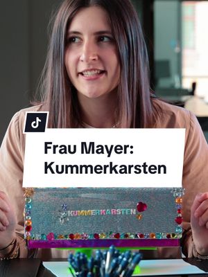 A post by @as_dialoggroup on TikTok caption: Falls ihr bei euch im Office das Wort „Kummerkasten“ hört: Rennt um euer Leben. #drbauer #letsskipthebla #parodie #fraumayer #comedy #sketch #it #office #büro #serie #marketing #viral #satire #kummerkasten #fyp