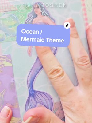 A post by @nanosken on TikTok caption: Replying to @hivunsure Perfect theme to show my new Mermaid Cove Sticker Sheet🐚🧜🏻‍♀️ Available on my Etsy now 🤗 #scrapbookwithme #junkjournal #asmr #journalwithme #scrapbooking #inspo #stationeryshop #etsyshop #SmallBusiness #stickers #mermaidtheme #scrapbookinspo 