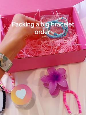 A post by @socobracelet on TikTok caption: Packing a big bracelet order for a customer 💞 #bracelets #preppyaesthetic #preppy #braceletbusiness #braceletlovers #claybeadbracelets 