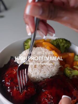 A post by @bodiedbyfia on TikTok caption: For the GAINS💞 yall ive been eating the same thing for 2 years straight! Just finding different ways to jazz it up. Recipe below! Honey Sriracha Salmon with Basmati Rice and Veggies <3 Ingredients: - 2 pieces of salmon - Seasoning of choice (I used):   - Montreal steak seasoning (trust me, it's worth trying)   - Minced garlic   - Onion powder   - Red pepper flakes   - Cayenne pepper   - Parsley    - Butter Instructions: 1. Preheat your oven to 450°F Bake the salmon for about 25-30 minutes (I like mine well done). Veggies: - 1 whole bell pepper - Broccoli Rice: - 1 cup of Basmati rice (made off camera) Sauce (made off camera): - A splash of soy sauce - 3 tablespoons of Sriracha - Generous amount of honey - Cayenne pepper - Juice from half a lemon Mix on the stove over high heat for about 2 minutes. I've been promising cooking content for SO long lol but i could never get the lighting right--I finally figured it out though🤭🤭🤭 what do y'all want to see next? ##highprotein##salmon##cooking##highproteinmeals