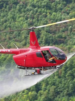 A post by @brandonquandt on TikTok caption: Cool trip to video some invasives being sprayed for wildlife habitat #helicopter #wildlife #fypage #videographer #sonya7siii #dji 