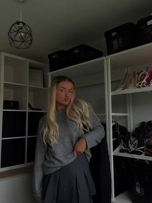 A post by @celiafarnon16 on TikTok caption: boots&bags🩶 #autumn #winter#outfit#fitcheck#fyp#grey#boots #bag #grwm#sweater#skort #skirt #fyp 