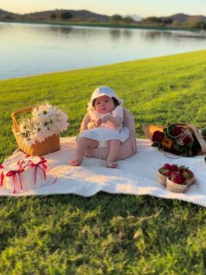 A post by @clariisaag on TikTok caption: 1/2 year photoshoot #fyp #fypシ゚viral #goldenhour #glow #baby #babyphotography #6months #photoshootideas #picnic #picnicaesthetic #strawberry #flowers #Summer #cake #newborn 