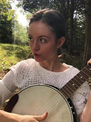 A post by @gabriellehopemusic on TikTok caption: you cant own the land - by me!! #folk #mountains #singer #banjo #country 