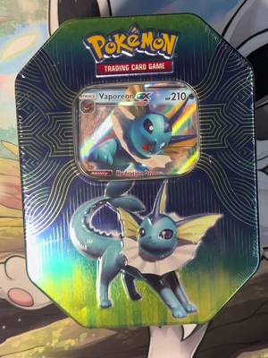 A post by @bindyrooz on TikTok caption: Opening this Vaporeon tin with a hit at the end 🩵😍   #pokemonblister #pokemonpackopening #pokemon #pokemontcg #vaporeon 