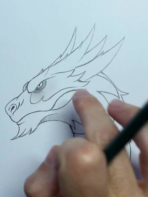 A post by @lesdessinsdezio on TikTok caption: Voici une astuce pour dessiner un dragon ! #dessin #tuto #tutodessin #dragon #debutant