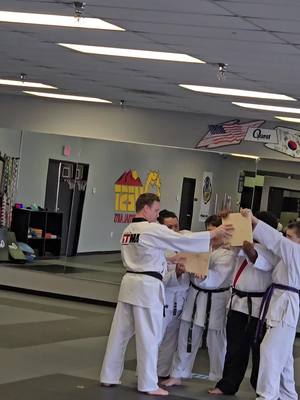 A post by @arnettsattic on TikTok caption: Michael Davis breaking boards for his 3rd degree black belt 