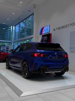 A post by @farnboroughbmw on TikTok caption: The New F70 M135 xDrive in Frozen Portimao Blue 😈 #bmw #bmwm #bmwmpower #bmwmperformence #New1series #F70m135 #M135 #fyp #foryoupage #cartok #cartiktok #group1bmwfarnborough #farnboroughbmw 