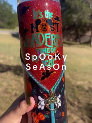 A post by @texasrosedesigns on TikTok caption: It’s the most wonderful time of the year!  It’s S p O o K y Season! This cup is currently available for purchase! Send me a message if you’d like to purchase it! It’s ready to ship. 👻🧙🏼🎃  #Halloween #HappyHalloween #Spooky #SpookySeason #Fall #Autumn #Disney #DisneyHalloween #MickeyAndMinnie #Glitter #GlitterTumblers #SmallBusiness #SmallBusinessSupport 