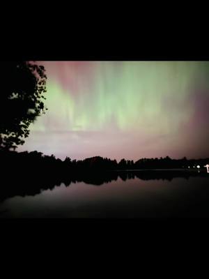 A post by @red.right.blue on TikTok caption: Being able to experience this at my favorite place was amazing! We have an awesome creator!🤍 The colors were so beautiful!✨ #northernlights #upnorthwisconsin #northwoodswisconsin #godscreation 