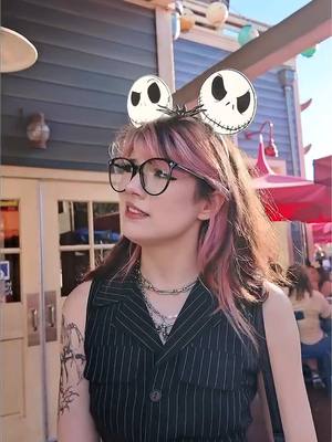 A post by @notmeggii on TikTok caption: I’m WREALLY starting to like disneyland 😊👻💀