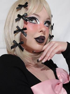 A post by @beatsbylizzie on TikTok caption: Cute and Spooky ft @Trixie Cosmetics Hotline gel liners and Feature black lipstick #blacklipstick #trixiecosmetics #cutemakeup #cutemakeuplook 