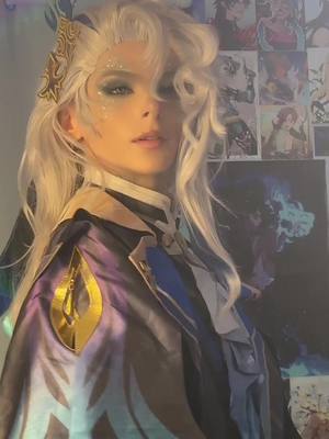 A post by @unfeign on TikTok caption: different kind of video today , lowkey nervous about posting it as im not a makeup professional 🪦 #neuvillette #genshin #GenshinImpact #genshinimpactcosplay #neuvillettecosplay #fontaine #cosplaygrwm 