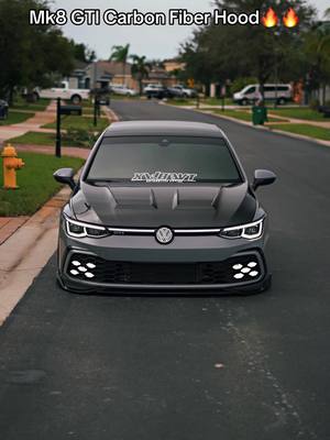 A post by @trippy.mk8 on TikTok caption: Mk8 gti with a carbon fiber hood 😍😍 thoughts ? Fenders next 😈#intrippywetrust #mk8 #vwgti #cartok #vwtok #carsoftiktok #carfyp #mk8golf #qoutesoftheday #swfl #mk8gti #qouteoftheday #carbonfiber 