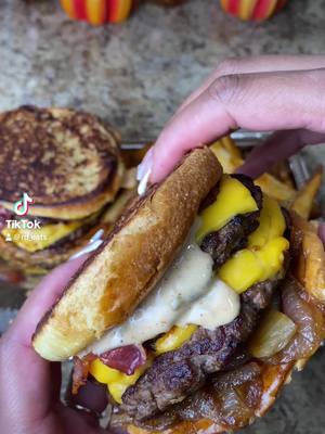 A post by @rd_eats on TikTok caption: Five Guys grilled cheeseburger and Cajun fries 🤤🍔🍟