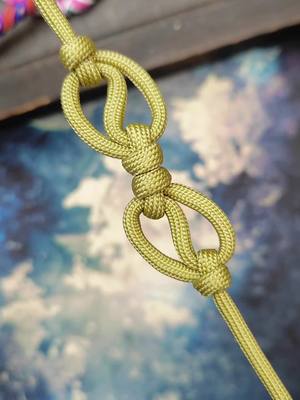 A post by @cordbraid on TikTok caption: Very nice decorative knot, very good with paracord for bracelets or as decoration#handmade #tutorials #diyproject #handicraft #paracord #tutorial #bracelet #selfmotivation #deko 